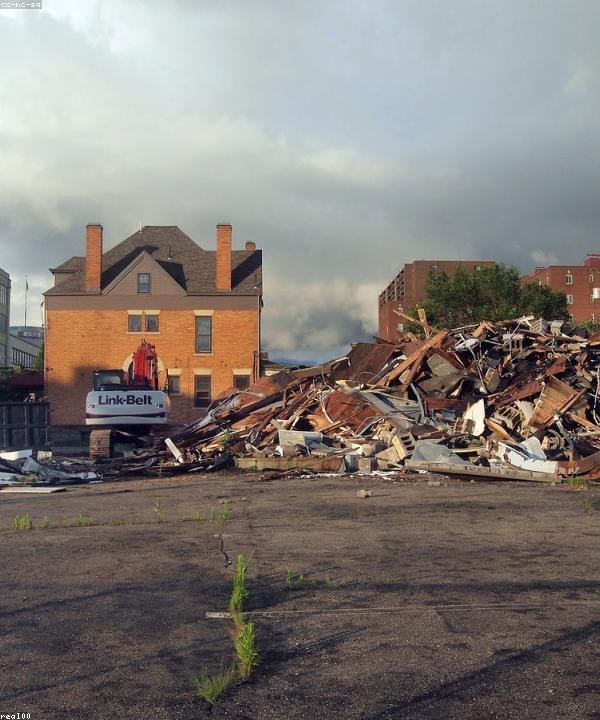 Local Ottawa demolition and construction project with debris and excavator